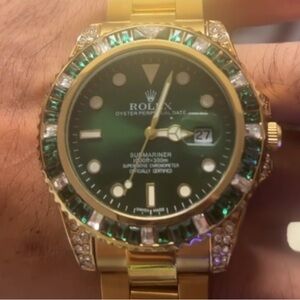 Rolex Submariner Gold and Green Timepiece